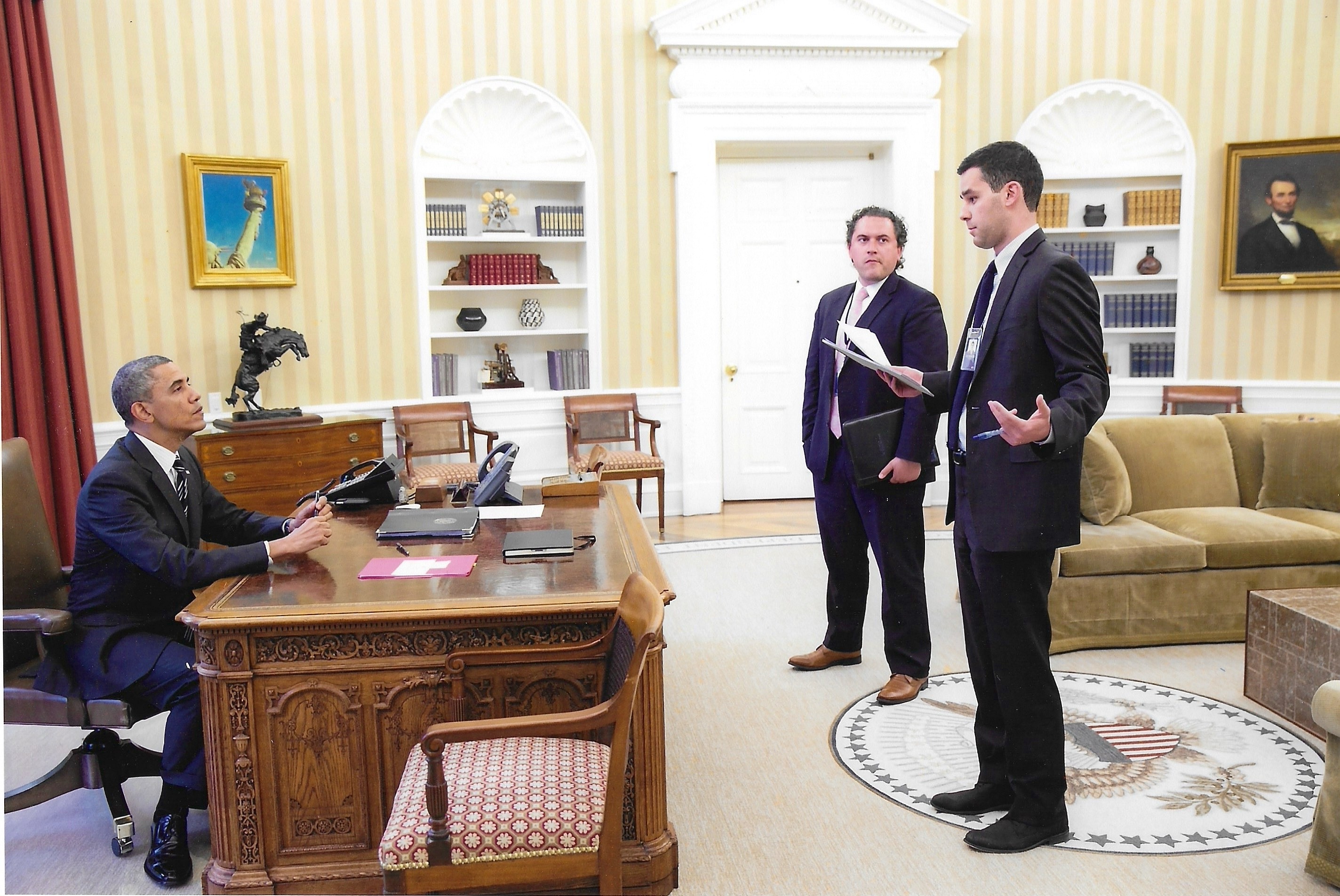 Kyle presenting to President Obama in the Oval Office